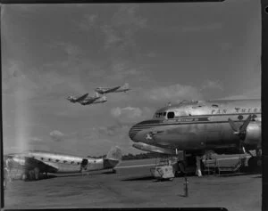 Clipper 'Westardward Ho', PAWA (Pan American World Airways), and a Dakota airplane, RNZAF (Royal New Zealand Airforce) at Whenuapai airbase, Waitakere City, Auckland