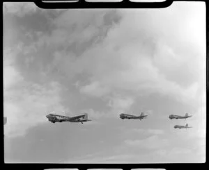 RNZAF (Royal New Zealand Air Force) Squadron 41, flying DC4 airplanes over Whenuapai airbase, Waitakere City, Auckland