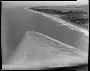 Looking over the wing of the aircraft to Paraparaumu Beach