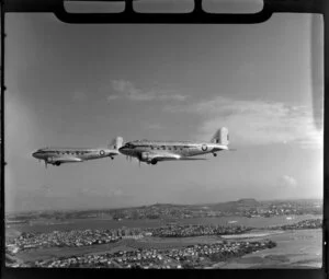 RNZAF (Royal New Zealand Air Force) Squadron 41, flying DC4 airplanes over North Shore, Auckland