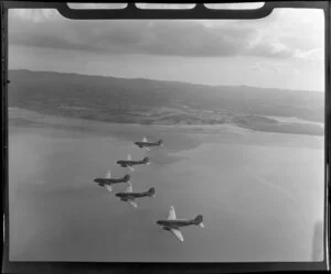 RNZAF (Royal New Zealand Air Force) Squadron 41, flying DC4 airplanes over the upper reaches of Auckland's Harbour
