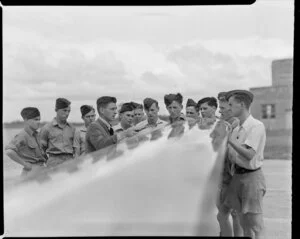 ATC [Air Training Corps] cadets at Whenuapai, receiving instruction about Harvard aircraft