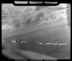 RNZAF (Royal New Zealand Air Force) 41 Squadron, Dakota airplanes, in flight over the west coast, Auckland