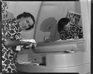 Miss Gwen Robyns in the washroom of a Douglas DC6 RMA Adventurer, British Commonwealth Pacific Airlines