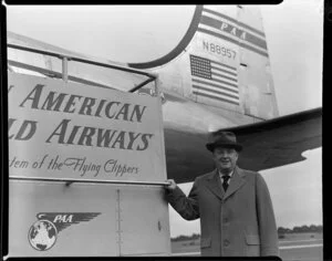 Matthew Cowley standing alongside a Pan American World Airlines Clipper aircraft
