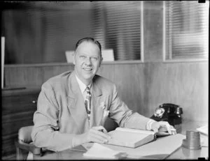 Mr T Parker Junior sitting in his office, Honolulu