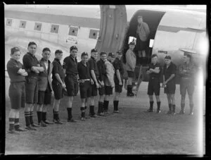 Students from Northland College, boarding a Douglas Dakota airplane