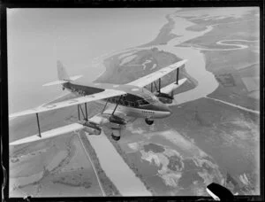 De Havilland biplane, ZK-AEG Karoro, flying over the Wairau Bar, Royal New Zealand Air Force air sales