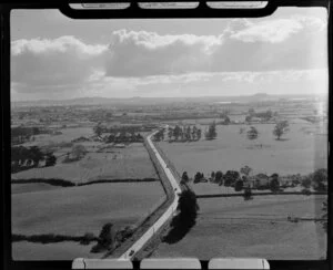 Road running through farm land, Papatoetoe, Auckland