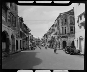 City street scene, Singapore, including bicyles, washing lines, and Ocean Studio Commerical Artist premises