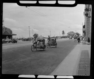 City street scene, Singapore, featuring bicycle rickshaws