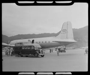 British Overseas Airways Corporation bus parked beside aircraft G-ALHP, Kai Tak airport, Kowloon, Hong Kong