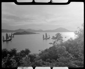 View of a bay with junk boats in sail, Hong Kong