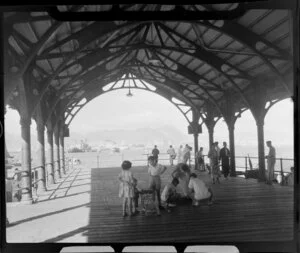 Children and adults on a covered pier, Hong Kong