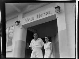 Unidentified man and woman at the entrance to Nadi Hotel, Fiji