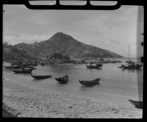 Chinese fishing boats or sampans berthed at a sandy beach, unidentified location, Hong Kong