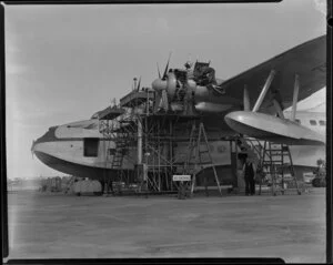 TEAL(Tasman Empire Airway Limited) staff, servicing the Solent flying boat 'RMA Awatere', Mechanics Bay, Auckland