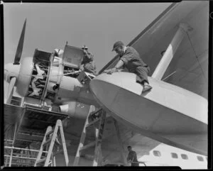 TEAL (Tasman Empire Airways Limited) staff, servicing a Solent flying boat, Mechanics Bay, Auckland