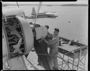 TEAL(Tasman Empire Airway Limited) staff, servicing a Solent flying boat, Mechanics Bay, Auckland