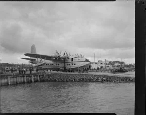 TEAL (Tasman Empire Airways Limited) staff, servicing the Solent flying boat 'Awatere', Mechanics Bay, Auckland