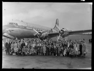Members of the Mormon Church standing alongside the Pan American World Airways Clipper Lightfoot, Whenuapai Airport