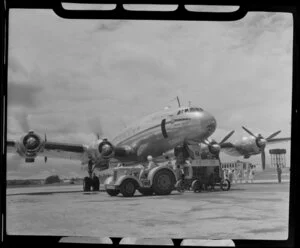 Qantas Empire Airways Lockheed L749-79 Constellation (VH-EAB) aircraft Lawrence Hargrave prepares for take off, Kallang Airport, Singapore, including tractor towing [motor? starter engine?]