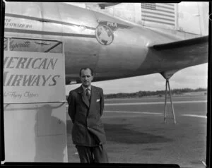 Passenger Jean Van de Poole, having arrived on a Pan American World Airways flight, stands in front of Douglas DC-4 Clipper Westward Ho (N88948) at Whenuapai aerodrome, Waitakere City, Auckland