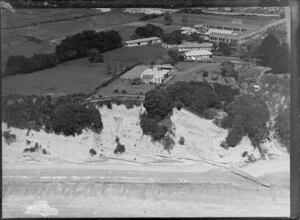 Coastal view of Takapuna, North Shore City, Auckland, featuring cliffs, Takapuna Grammar School grounds, a single storied house with a tennis court [headmaster's residence?] and Waitemata Harbour
