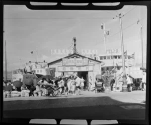 Ferry terminal, Hong Kong, featuring Lee Hong Ferry and including rickshaws and people using umbrellas for shade