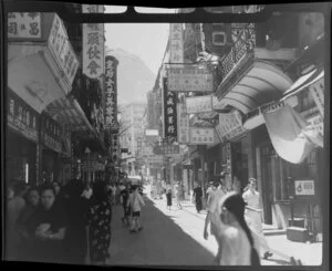 Busy street scene, Hong Kong, featuring many businesses including Yue Hing Hong (agent of The Texas Company China Ltd)