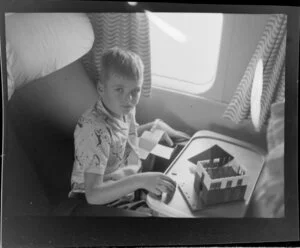 Boy passenger on British Overseas Airways Corporation aircraft, Dragon route from Singapore