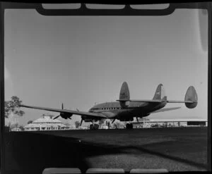 The British Overseas Airways Corporation Lockheed L-749A Constellation (G-ALAK) aircraft Brentford at Darwin Airport, Northern Territory, Australia, including terminal building and hangars