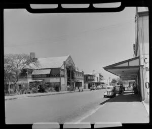Street scene, Darwin, Northern Territory, Australia, including businesses such as Koolpinyah Kool Stores (Butchers Ice & Cold Storage), Hotel Victoria, and Royal Mail agent and coach booking office