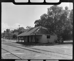 Darwin Railway Station, Northern Territory, Australia, including unidentified men sitting in the shade of a tree