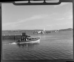 A motor boat going out to meet a seaplane, Rose Bay, sydney