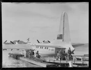 Passengers and crew beside the Tasman Empire Airways Ltd Solent Aircraft ZK-AMO, Mechanics Bay, Auckland