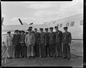 Men from the Air Force Reserve standing alongside a seaplane, Mechanics Bay, Auckland