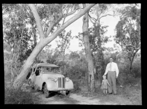Mr N Jones with his son in an Australian bush scene