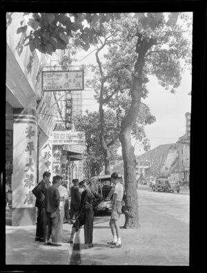 Street scene, Kowloon, Hong Kong, including businesses Woo-Ping Gold and Money Changer and Wai Yet Beauty Parlour