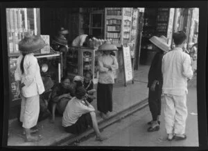 Street scene, Hong Kong, featuring conversing women