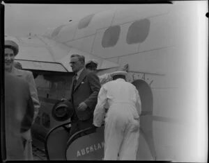 Passengers leaving the Tasman Empire Airways Ltd Short Solent flying boat RMA Ararangi ZK-AMM, Mechanics Bay, Auckland
