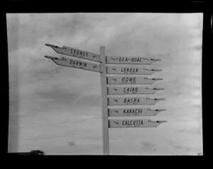 Qantas Empire Airways sign post showing directions to overseas airports, Tengah Airport, Singapore