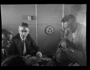 Sir Wilmot Hudson Fysh, airline director, with N Ellison on the right, on board the Tasman Empire Airways Ltd Short Solent flying boat, Sydney to Auckland flight