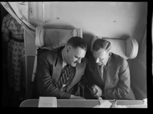 A G Gerrand (left) with Mr Sumpter on board the Tasman Empire Airways Ltd Short Solent flying boat, Sydney to Auckland flight