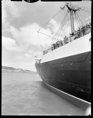Passenger ship, Remuera, at Wellington with passengers waving from the deck