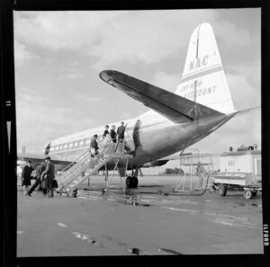 Member of cabin crew watching passengers enter NAC Viscount jet aeroplane