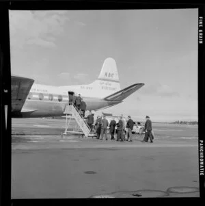 Passengers climbing stairs to enter NAC Viscount jet aeroplane