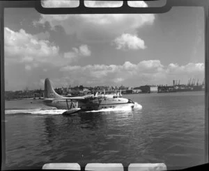 Tasman Empire Airways Ltd aircraft taking off, Mechanics Bay, Auckland