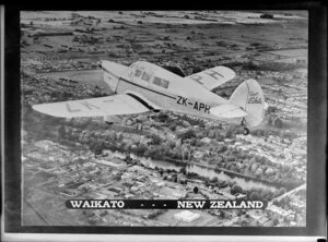 Aeroplane, Spirit of Waikato, ZK-APH, flying over [Hamilton?], Waikato