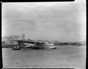 Tasman Empire Airways Ltdl, Solent IV flying boat, RMA Aranui, ZK-AMO, tied up at pantoon, {Mechanics Bay?], Auckland